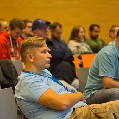 CMS Conf attendees listening to a talk